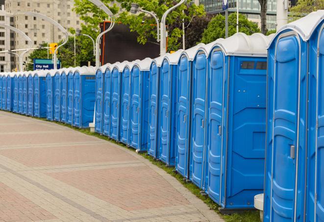 a row of portable restrooms at a fairground, offering visitors a clean and hassle-free experience in doffing